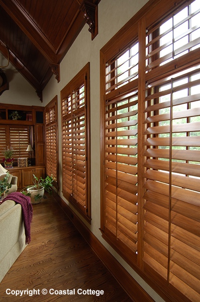 Stained hardwood shutters — Sunroom